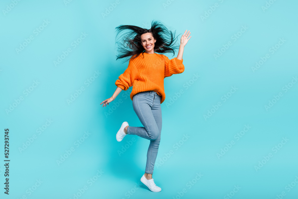Full body photo of charming sportive lady jumping have good mood isolated on teal color background