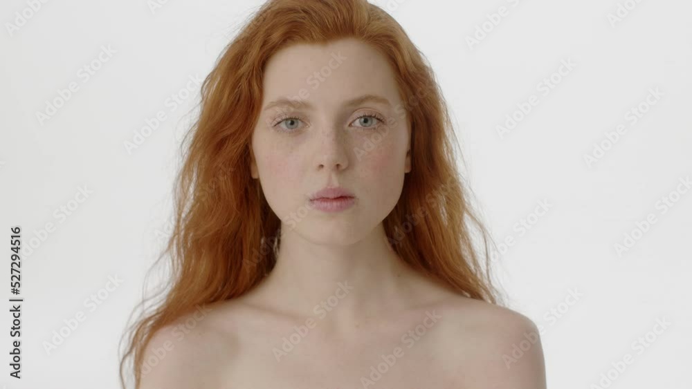 Beauty Woman face Portrait. Attractive Spa model Girl with Perfect Fresh Clean Skin. Caucasian Female with Ginger haircut with naked shoulders opening her Beautiful Eyes and looking at camera with Beauty Woman face Portrait. Attractive Spa model Girl with Perfect Fresh Clean Skin. Caucasian Female with Ginger haircut with naked shoulders opening her Beautiful Eyes and looking at camera with