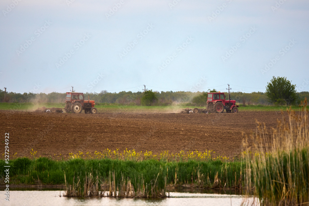 Fototapeta premium a tractor that works the land to be cultivated