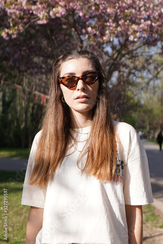 portrait of a woman with sunglasses in the city park of varna bulgaria 