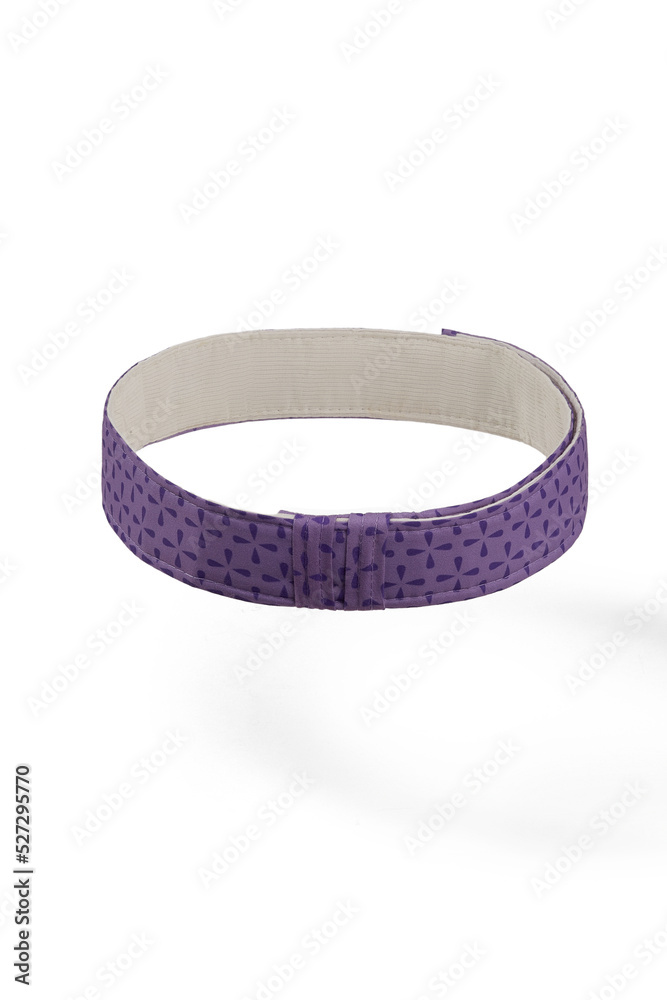 Close-up shot of purple fabric strips with little side belts for size adjustment for a cake pan. Bake even strips are isolated on a white background. Top view. Close-up shot of purple fabric strips with little side belts for size adjustment for a cake pan. Bake even strips are isolated on a white background. Top view.