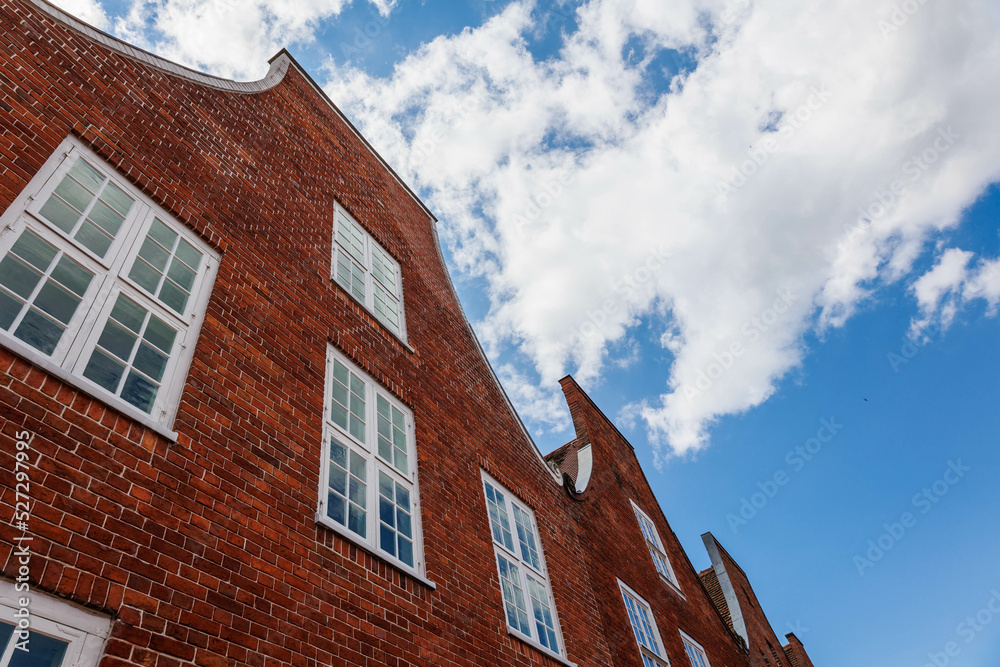 red brick building and blue sky above