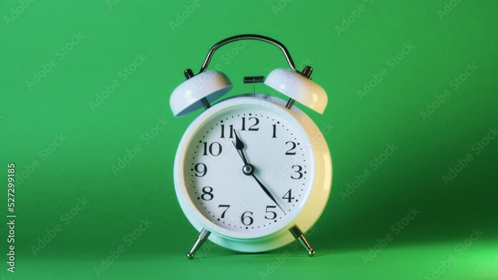 analog clock goes on a green screen, timelapse, fast passage of time.