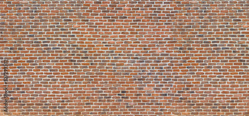 Old red brick wall background, wide panorama of masonry 