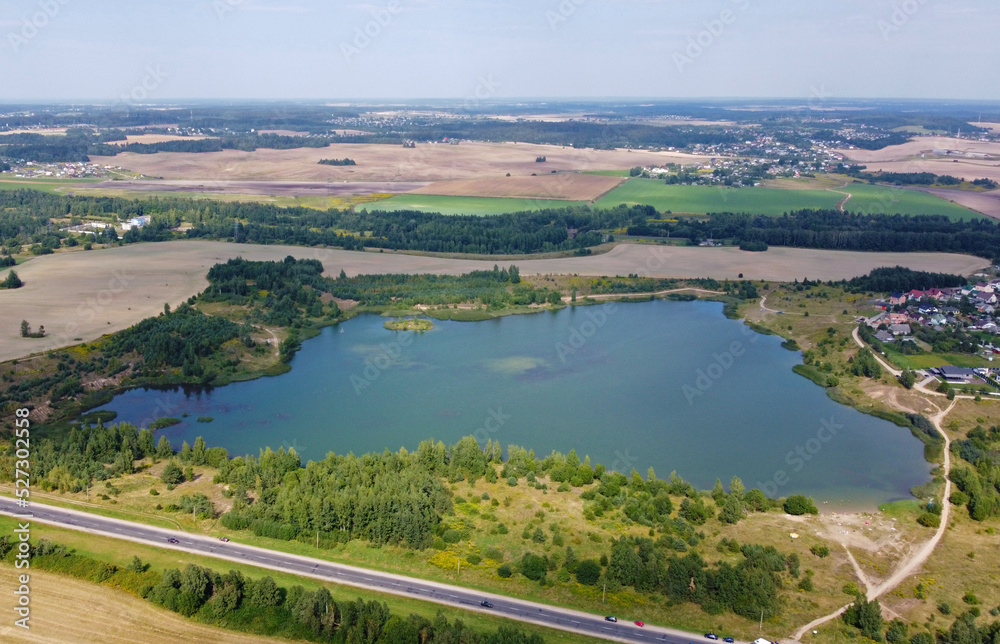 Aerial view of a beautiful suburban lake in an expensive elite neighborhood