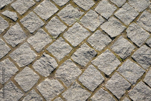 Canvas Print Chipped stone pavement background texture