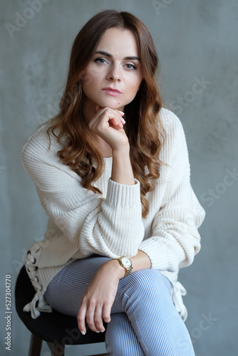 фотографія Happy friendly woman posing indoor at home in casual clothes