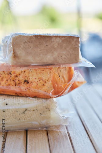 Vegan assorted bean curd, tofu on the wooden table. Alternative a soy-based food, natural product photo