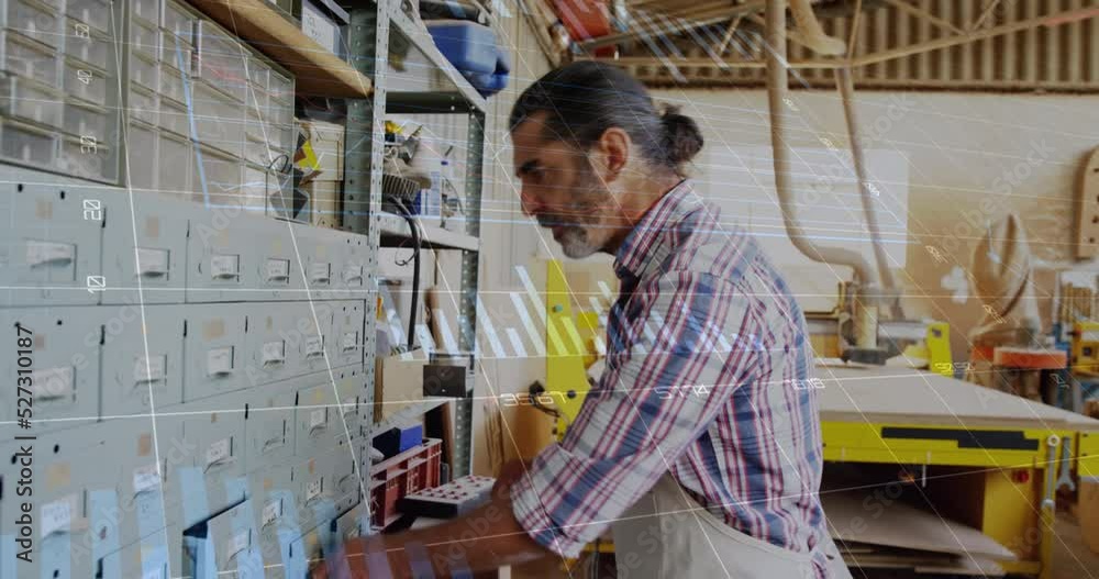 Animation of data processing over caucasian male carpenter working in workshop Animation of data processing over caucasian male carpenter working in workshop
