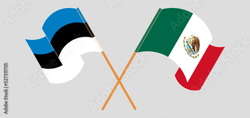 Crossed and waving flags of Estonia and Mexico photo