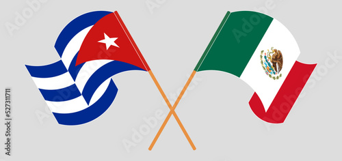 Crossed and waving flags of Cuba and Mexico