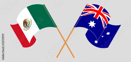 Crossed and waving flags of Mexico and Australia