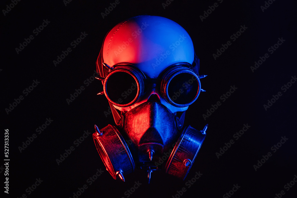 human skull steampunk glasses and a gas mask with red and blue neon light on a black background Stock Photo | Adobe Stock