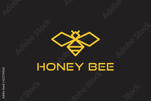 honey bee modern logo in gold color isolated on dark background