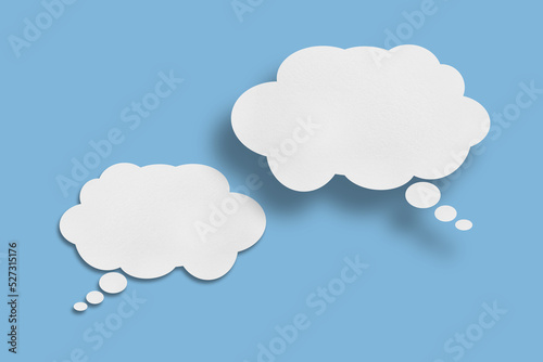 white cloud paper speech bubble shape against blue background