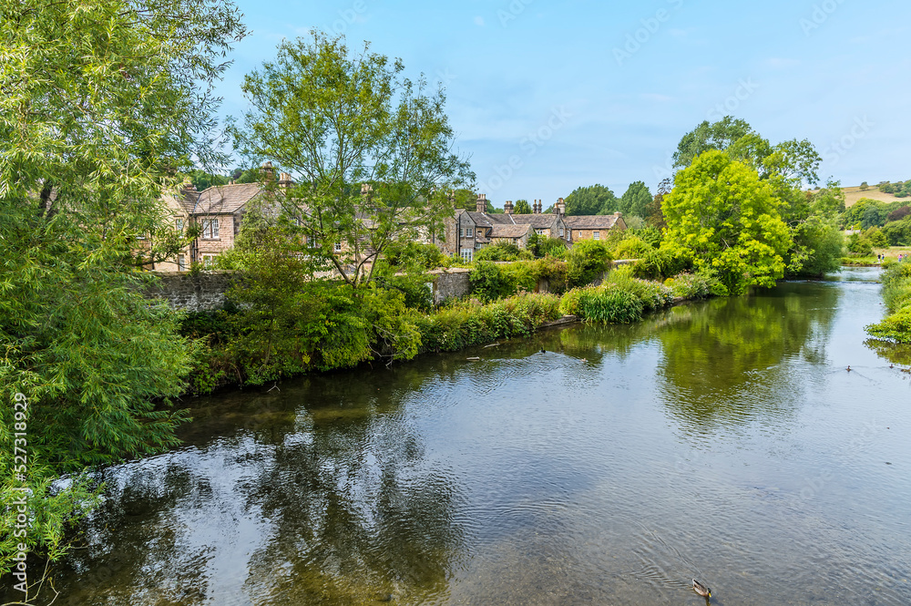 A view down the river Wye at Bakewell close to the Monsal Trail in Derbyshire, UK in summertime A view down the river Wye at Bakewell close to the Monsal Trail in Derbyshire, UK in summertime