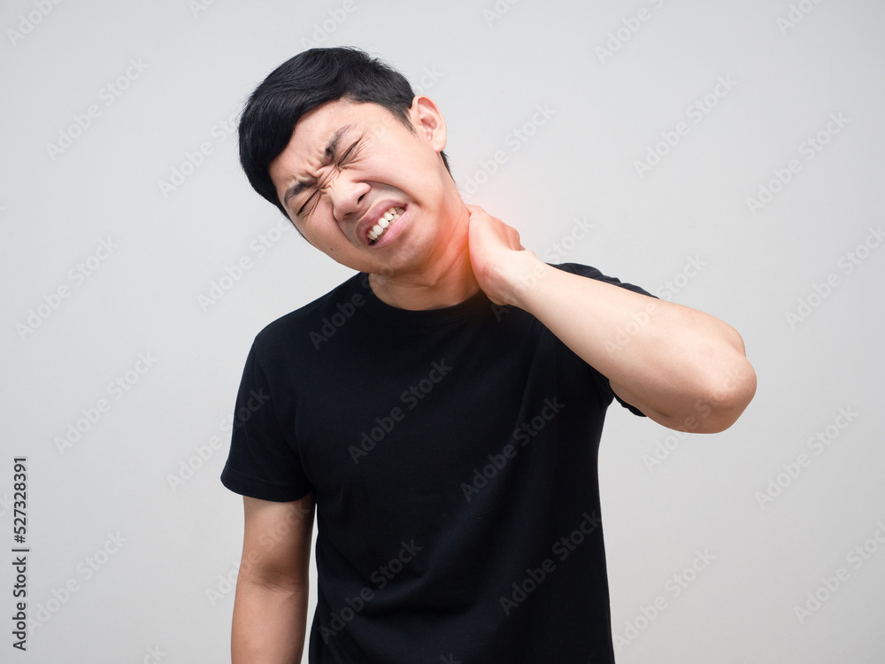 Young man feels pain his neck from office syndrome Young man feels pain his neck from office syndrome
