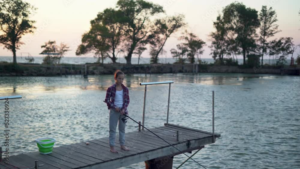 boy fishman with fishing rod by the lake, summer hobby and leisure boy fishman with fishing rod by the lake, summer hobby and leisure