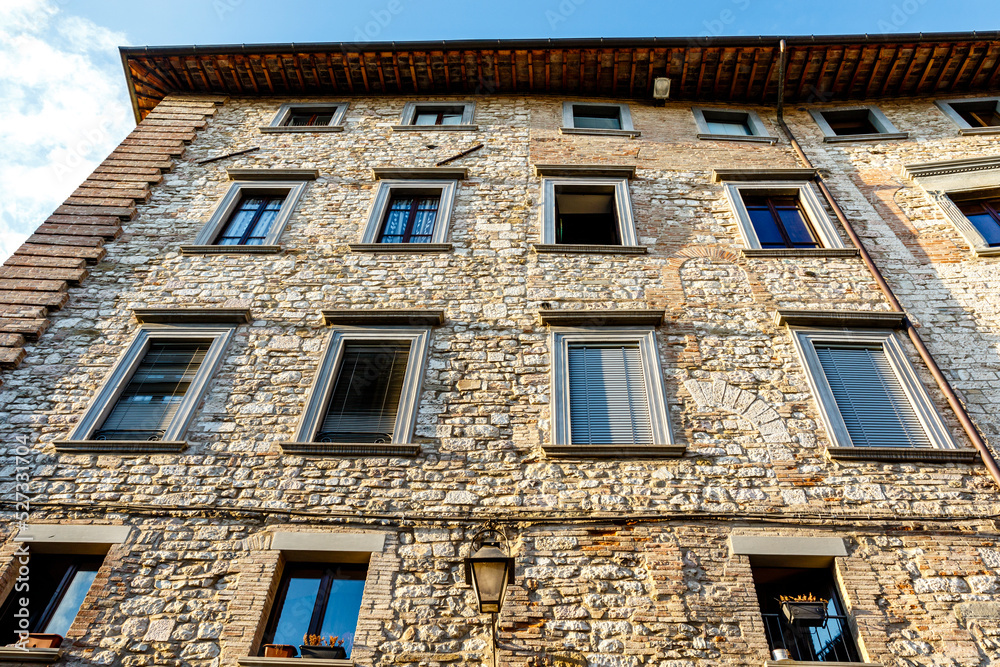 Obraz premium Facades of medieval houses in the center of Gubbio, Umbria, Italy, Europe