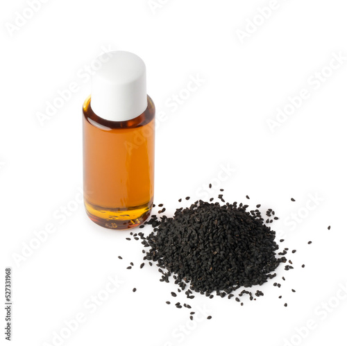 pile of black seeds and black seed oil bottle, also known as black cumin or caraway or kalonji, isolated on white background, mock-up template