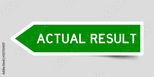 Green color arrow shape sticker label with word actual result on gray background