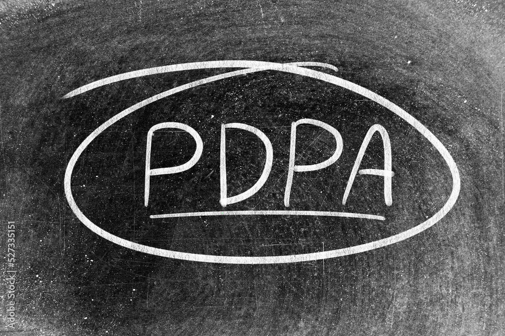 White chalk hand writing in word PDPA (Abbreviation of personal data protection act) on blackboard background White chalk hand writing in word PDPA (Abbreviation of personal data protection act) on blackboard background