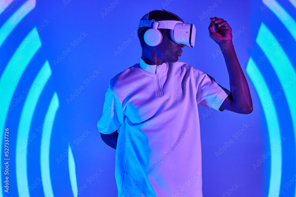 Concentrated black man experiencing virtual reality Concentrated black man experiencing virtual reality