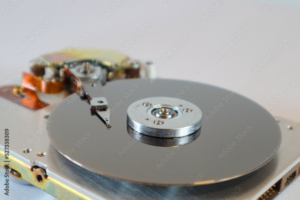 Disassembled computer hard drive. Data hard drive backup disc hdd disk restoration. Hdd with mirror effect. Disassembled computer hard drive. Data hard drive backup disc hdd disk restoration. Hdd with mirror effect.