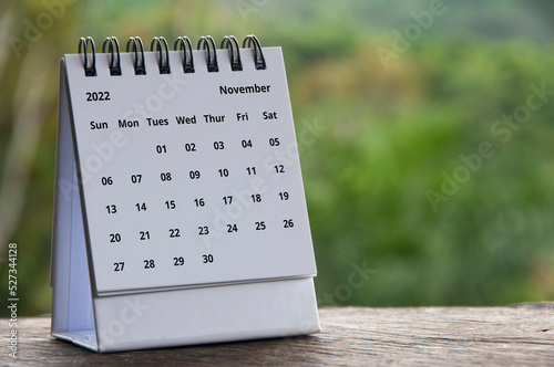 September month calendar with November month calendar with blurred nature background. Copy spaceblurred nature background. Copy space and new month concept photo