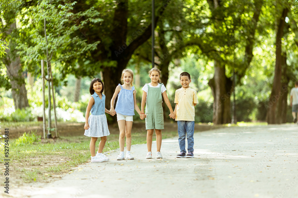 Group of asian and caucasian kids having fun in the park Group of asian and caucasian kids having fun in the park
