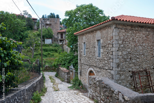 Stemnitsa, Greece / July 2022: Historic traditional village at the slopes of Mainalon mountain in the Peloponnese. Medieval building. photo