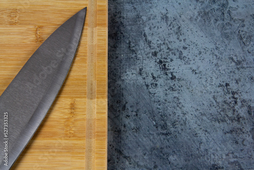 Kitchen knife and wooden cutting board