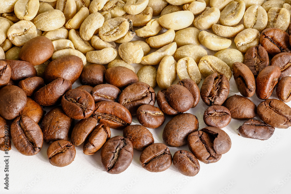 roasted and unroasted coffee beans on white background roasted and unroasted coffee beans on white background