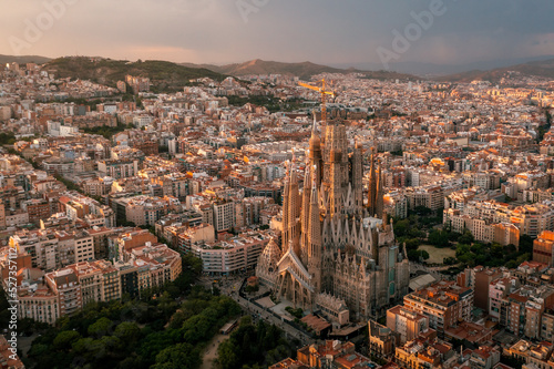 Aerial view from the City of Barcelona and the architecture of Sagrada Familia during sunset