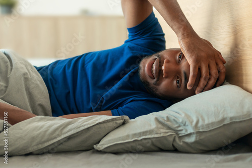 Black Man Touching Head Having Insomnia And Headache In Bedroom