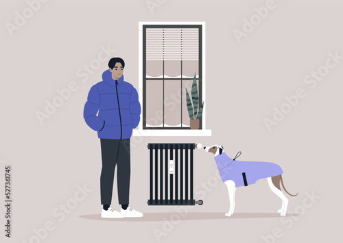 A young male Asian character freezing at home with their dog due to high heating price, European energy crisis