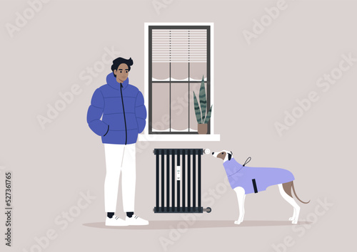 A young male Caucasian character freezing at home with their dog due to high heating price, European energy crisis