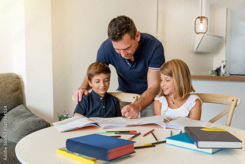Smiling children drawing and studying at home with a private tutor. Personalized tutoring for kids. School reinforcement homework Smiling children drawing and studying at home with a private tutor. Personalized tutoring for kids. School reinforcement homework