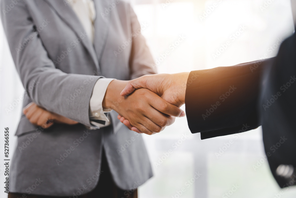 business partner handshake concept Colleagues shaking hands Successful deal after a great meeting. Blurred background. business partner handshake concept Colleagues shaking hands Successful deal after a great meeting. Blurred background.