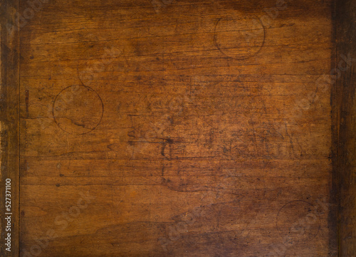 Close-up of worn antique cutting board with drinking glass rings