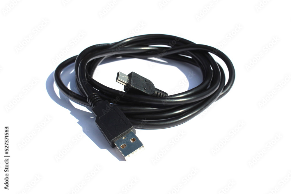The black cable for connection lies on a white isolated background. The black cable for connection lies on a white isolated background.