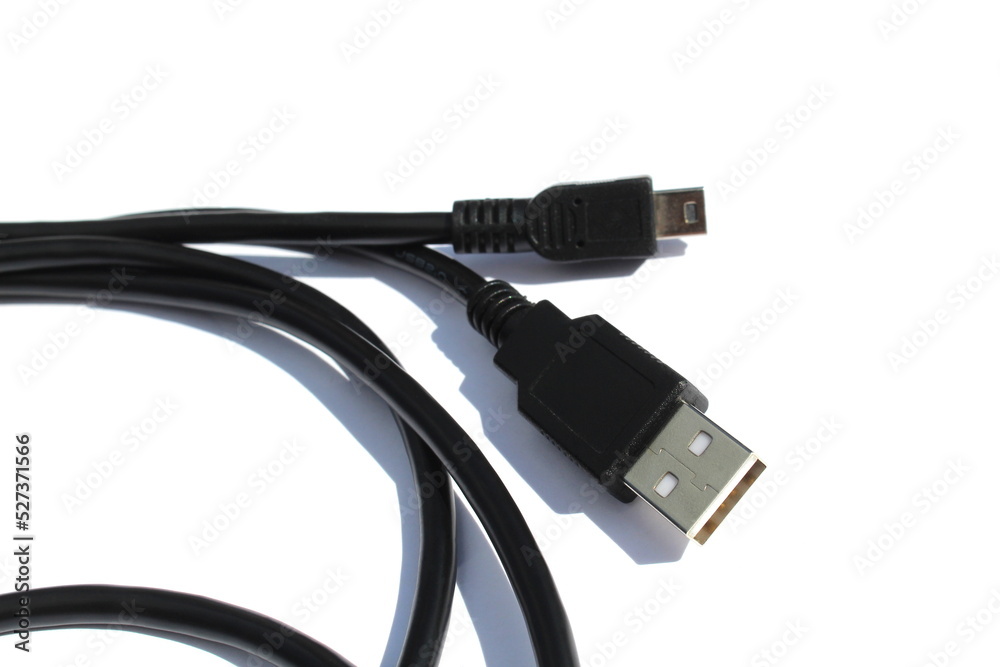The black cable for connection lies on a white isolated background. The black cable for connection lies on a white isolated background.
