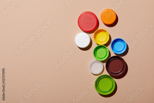 Overhead view of colorful bottle caps photo