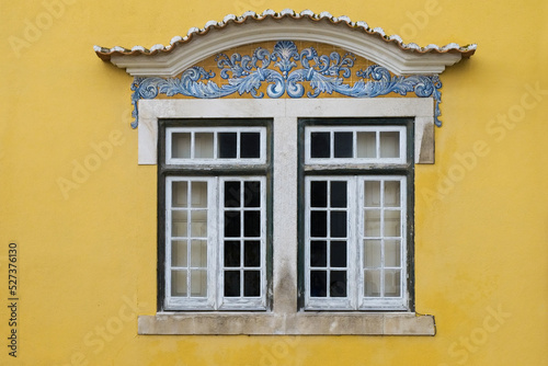 Portugal, Santarem, Yellow building with traditional tile work photo