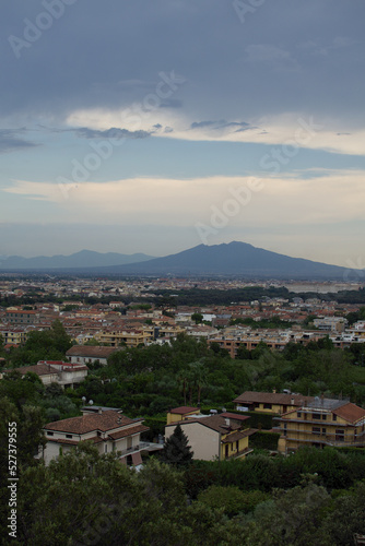 Romantic sunset with landscape in contrast between Vesuvius volcano shadows and blue sky