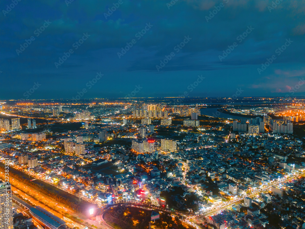 Aerial view of a buildings with highway at night in Ho Chi Minh city, Vietnam