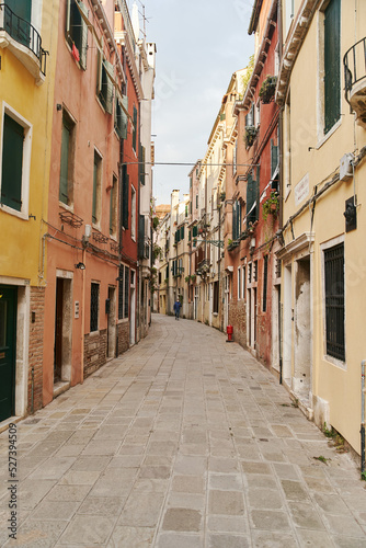 Empty narrow cobbled street in Venice, Italy. High quality photo © Dima Anikin