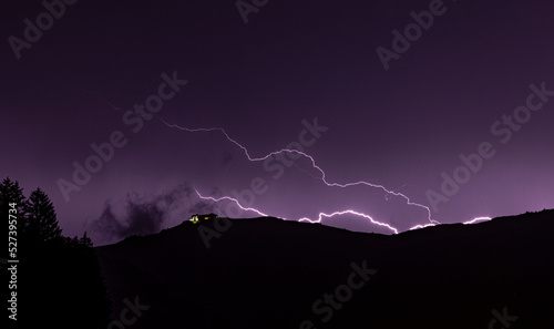 Zell am See, Austria, August 2022, lightning during a storm over the summit of the Schmittenhohe  photo