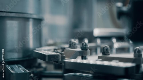 A fully automatic capsule filling machine is an electromechanical system that fills either hard or soft gelatin capsules with appropriate materials or substances. Close up, DOF, 4K