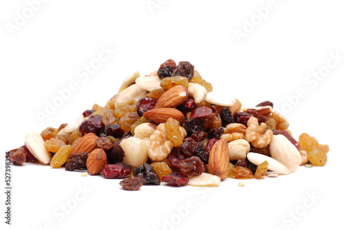 Mix of nuts and dry fruits isolated on a white transparent background, almonds, walnuts, hazelnuts and raisons on a pile, healthy food photo